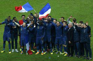 France's soccer team coach Deschamps and team mates celebrate after winning their 2014 World Cup qualifying second leg playoff soccer match against Ukraine at the Stade de France in Saint-Denis near Paris