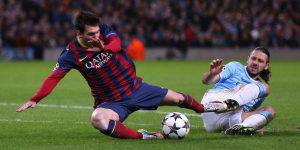 MANCHESTER, ENGLAND - FEBRUARY 18:  Martin Demichelis of Manchester City fouls Lionel Messi of Barcelona to concede a penalty and is subsequently sent off during the UEFA Champions League Round of 16 first leg match between Manchester City and Barcelona at the Etihad Stadium on February 18, 2014 in Manchester, England.  (Photo by Clive Brunskill/Getty Images)
